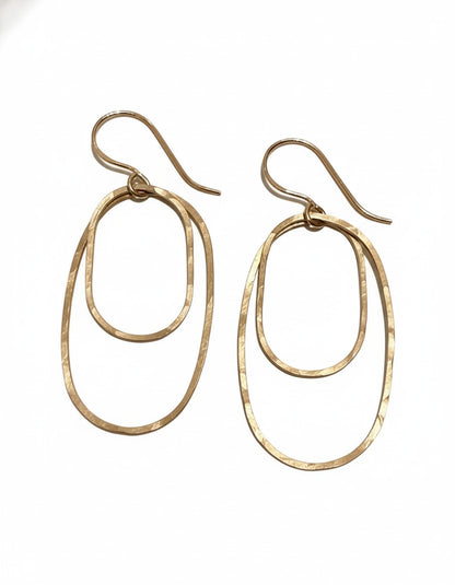 Gold hoop earrings on a white background