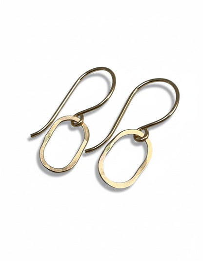 Gold hoop earrings on a white background