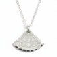 Silver necklace with a decorative pendant on a light gray background
