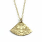 Gold necklace with a decorative pendant on a light gray background