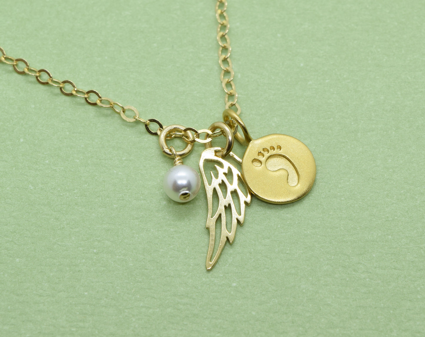 Gold Baby Foot Charm Necklace with Angel Wing Pendant and Pearl