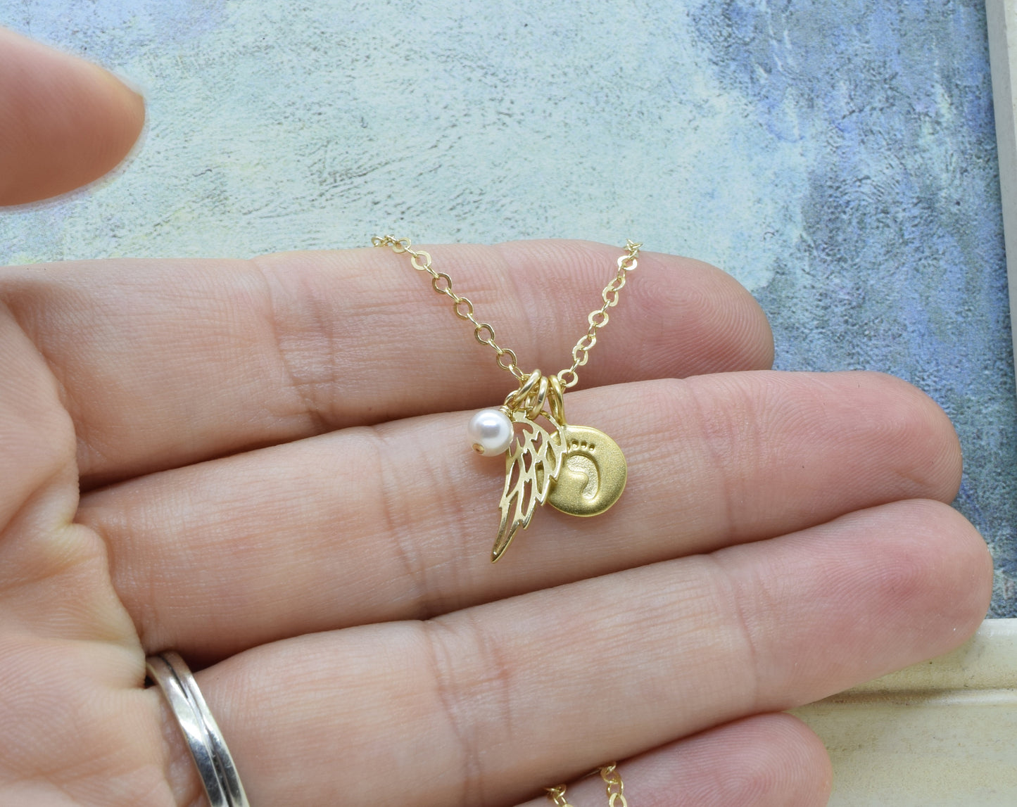 Gold Baby Foot Charm Necklace with Angel Wing Pendant and Pearl