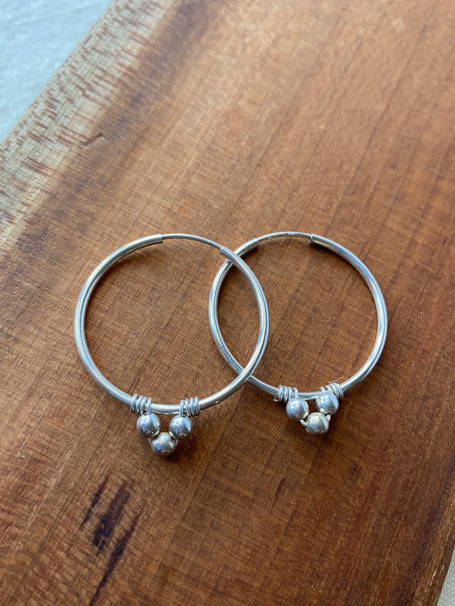 Endless Silver Hoop Earrings with Bead Accents - Cloverleaf Jewelry