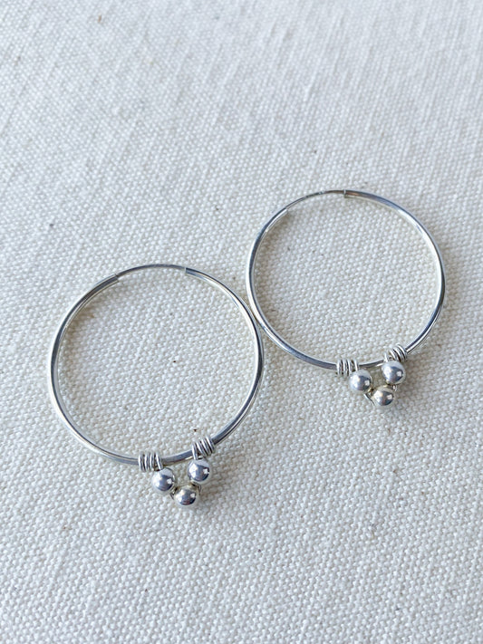 Endless Silver Hoop Earrings with Bead Accents - Cloverleaf Jewelry