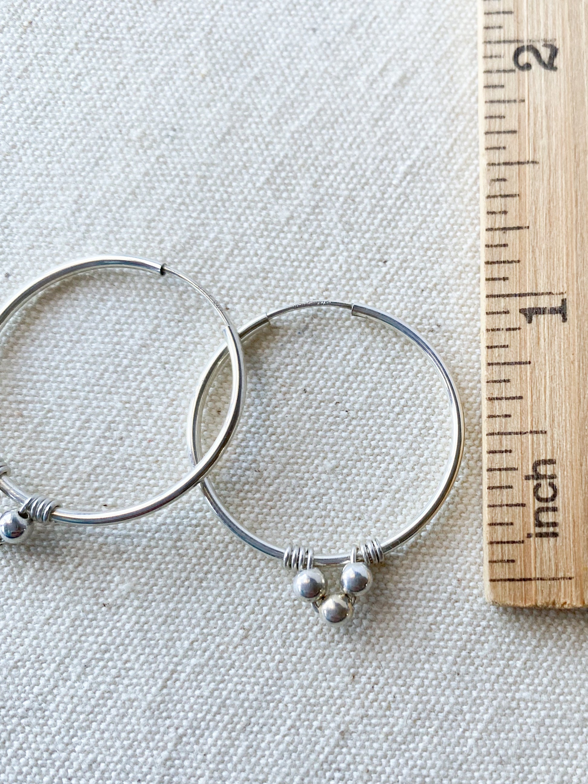Endless Silver Hoop Earrings with Bead Accents - Cloverleaf Jewelry